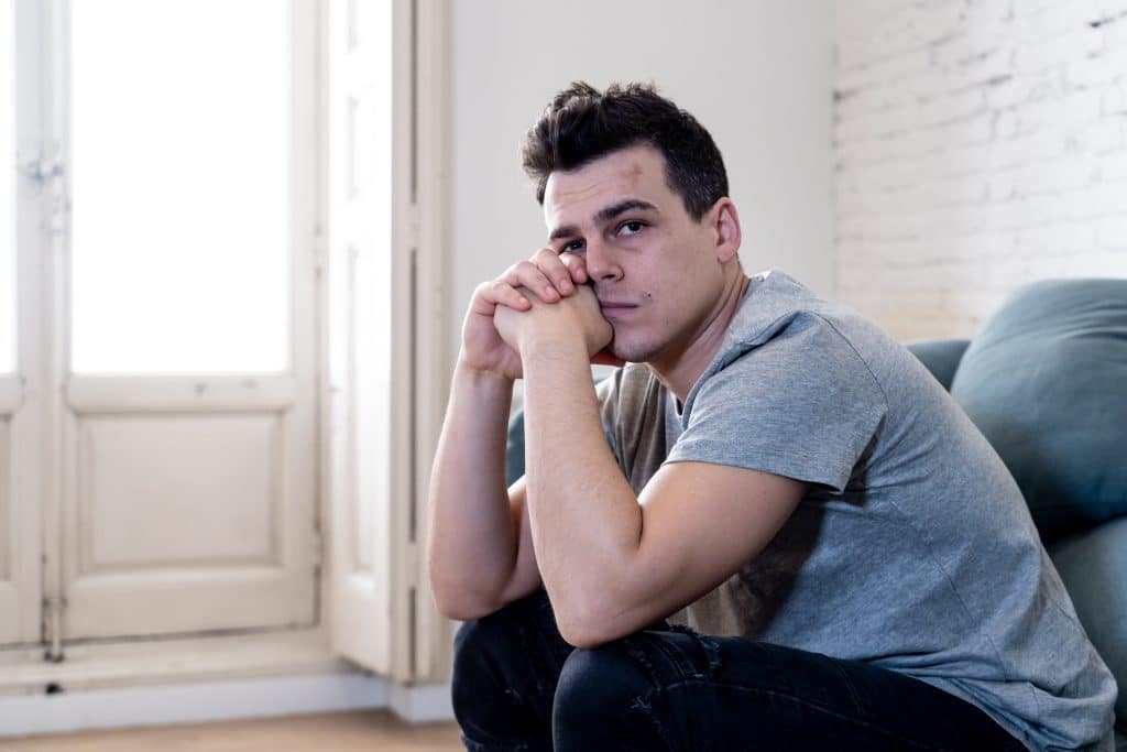 A person contemplating their struggles with addiction and seeking support. Reach Out for Addiction Help