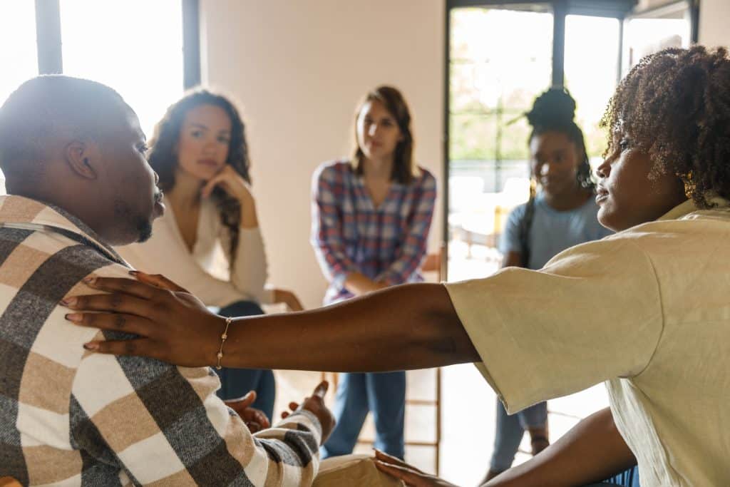A group of individuals participating in a support group meeting